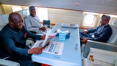 Abia State Governor, Okezie Ikpeazu grins as he travels with President Buhari to London