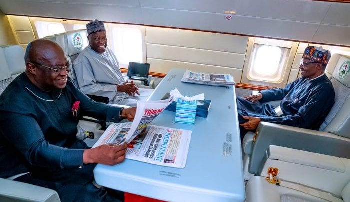 Abia State Governor, Okezie Ikpeazu grins as he travels with President Buhari to London