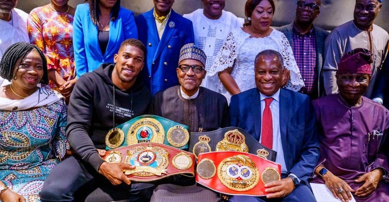 anthony joshua presents belts to Buhari