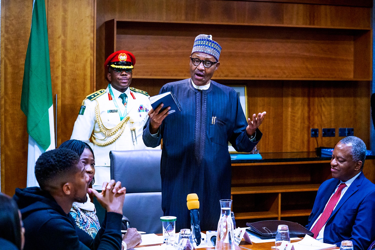 anthony joshua presents belts to Buhari 