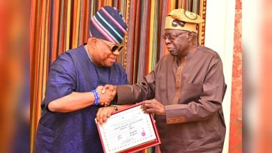 Ademola Adeleke presents his 2026 gubernatorial certificate of return to President Bola Tinubu