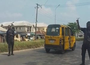 Police officers stopping commercial drivers at Iba Junction along LASU-Igando Road