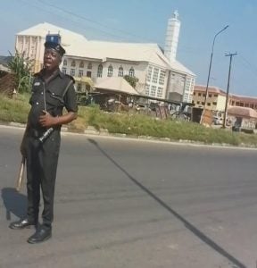 One of the police officers at NNPC Bus Stop checkpoint.