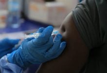 A health care worker administers a dose of Ervebo vaccine against the Ebola virus in Congo, on Oct. 16 – Sebastien Kitsa Musayi/AP